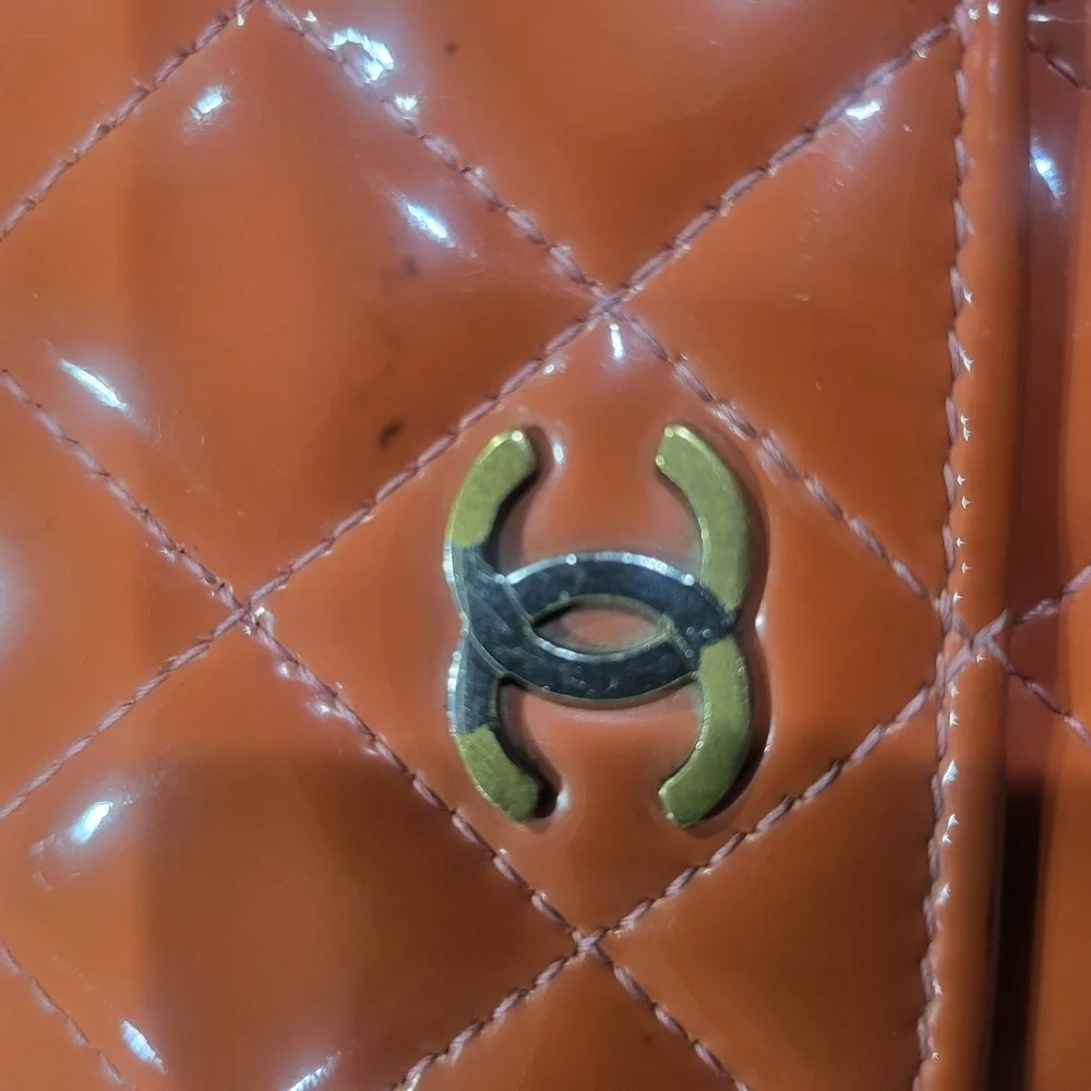 CHANEL Quilted Orange Matelasse Gold CC Logo Patent Leather Long Bifold Wallet.